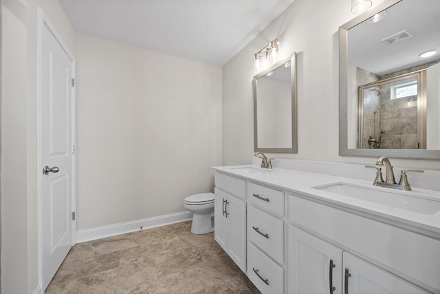 bathroom with double vanity, a stall shower, visible vents, and a sink