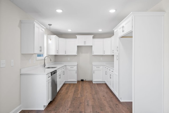 kitchen featuring recessed lighting, a sink, dark wood-style floors, dishwasher, and pendant lighting