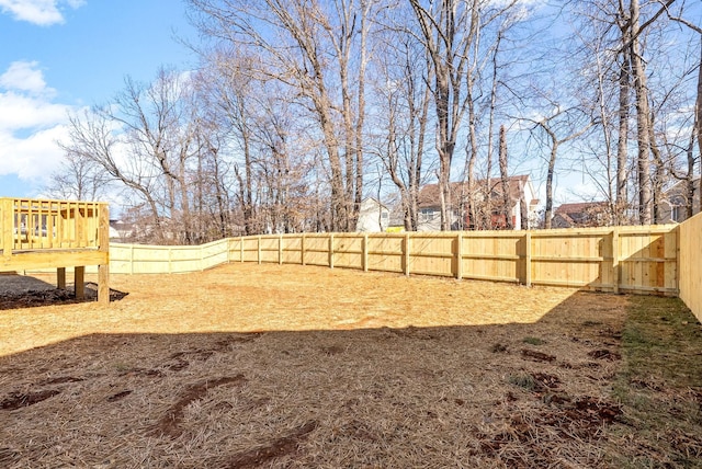 view of yard with a fenced backyard