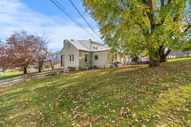 view of home's exterior featuring a lawn