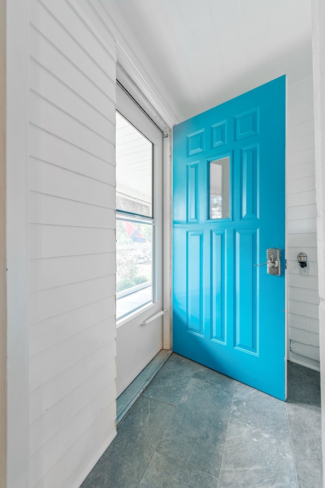 foyer entrance featuring concrete floors