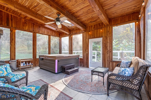 sunroom featuring vaulted ceiling with beams, ceiling fan, wooden ceiling, and a hot tub