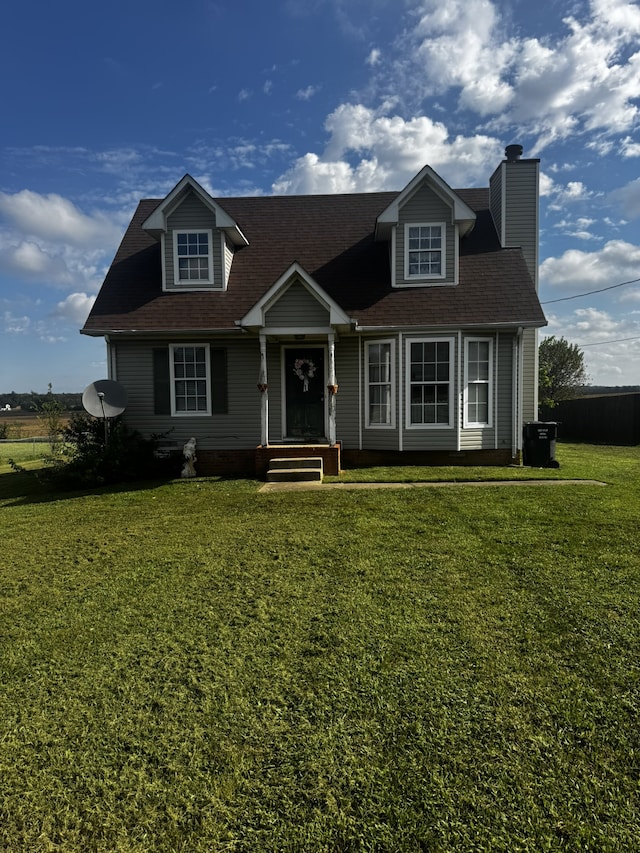 new england style home with a front lawn