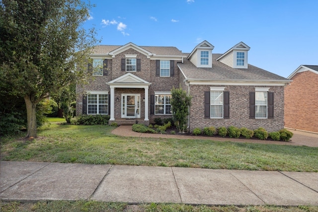 view of front of home with a front lawn