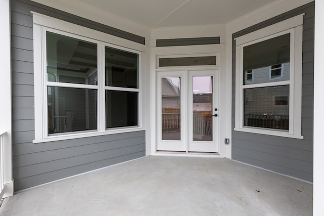 entrance to property featuring a patio