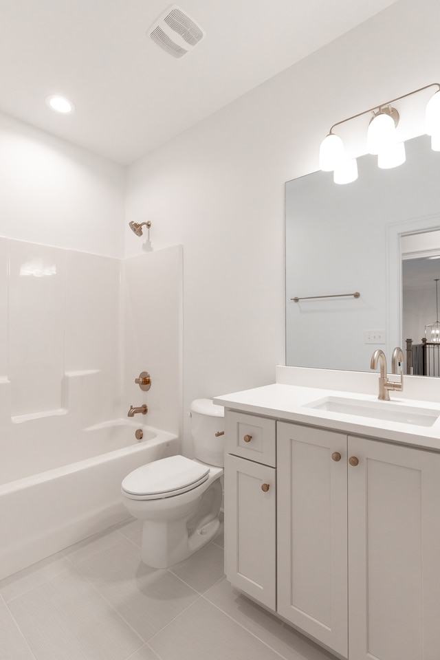 full bathroom with tile patterned flooring, shower / bathing tub combination, vanity, and toilet