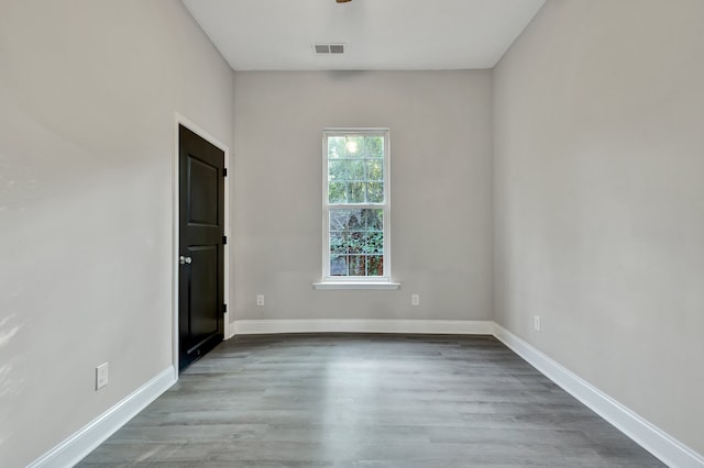 unfurnished room featuring hardwood / wood-style flooring