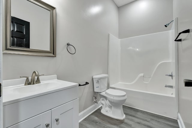 full bathroom featuring shower / bathing tub combination, vanity, toilet, and wood-type flooring