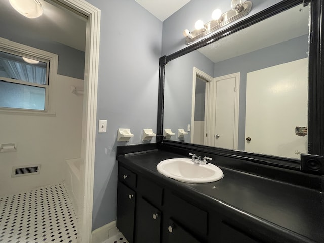 bathroom featuring plus walk in shower and vanity