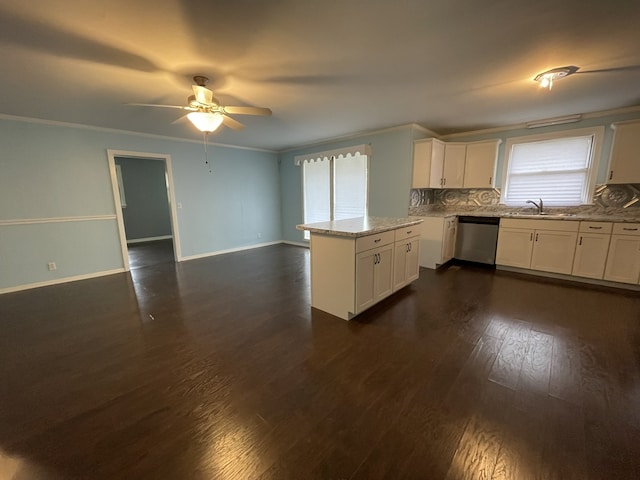 kitchen featuring dishwasher, decorative backsplash, dark hardwood / wood-style flooring, and white cabinetry