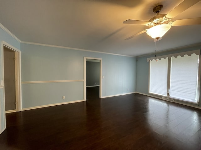 spare room featuring ceiling fan, dark hardwood / wood-style floors, and ornamental molding