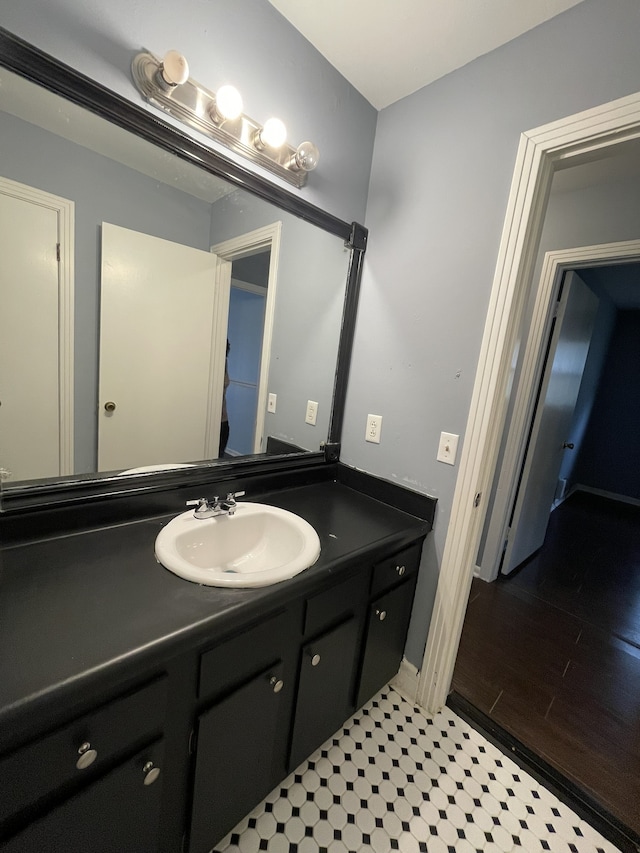 bathroom featuring hardwood / wood-style floors and vanity