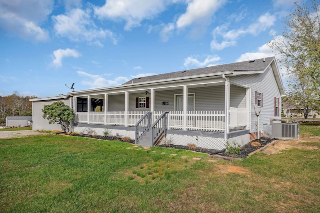 view of front facade with a porch, a front yard, and central AC