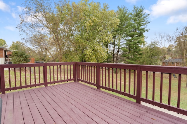 wooden deck with a lawn