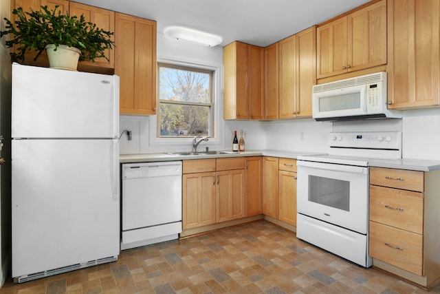 kitchen featuring sink and white appliances