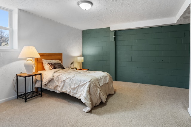 carpeted bedroom with a textured ceiling