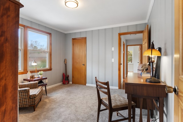 office featuring a healthy amount of sunlight, ornamental molding, and carpet floors