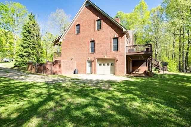 view of property exterior with a lawn, a deck, and a garage