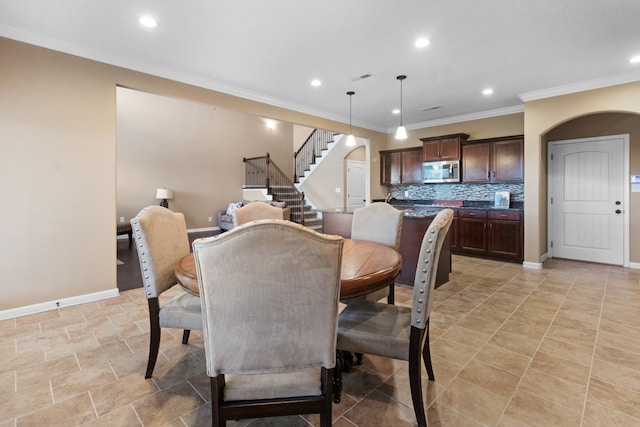 dining area with ornamental molding