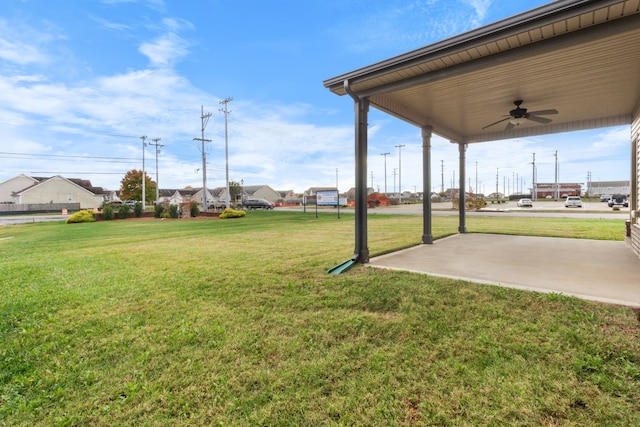 view of yard featuring a patio and ceiling fan