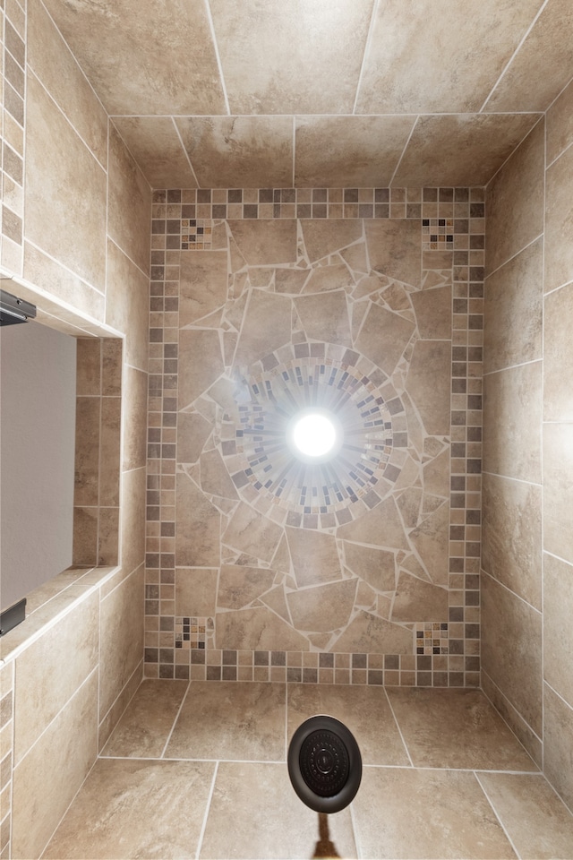 bathroom with tiled shower