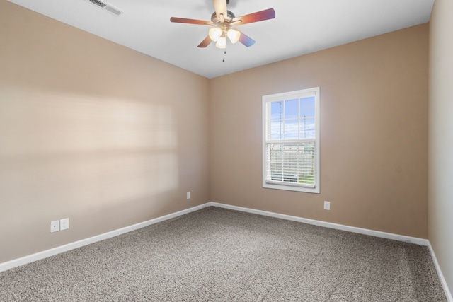 spare room with carpet flooring and ceiling fan