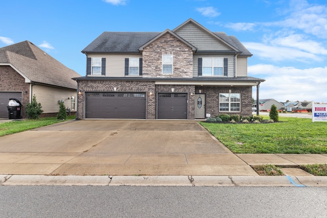 view of front facade with a garage and a front lawn