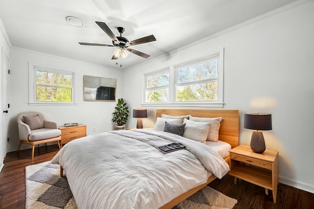 bedroom with ornamental molding, dark hardwood / wood-style floors, and ceiling fan