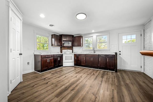 kitchen with stainless steel microwave, sink, dark hardwood / wood-style floors, and white range with electric stovetop