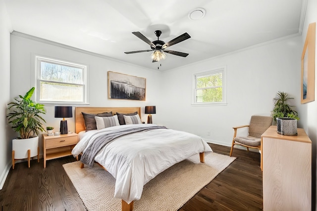 bedroom with ornamental molding, dark hardwood / wood-style floors, and ceiling fan