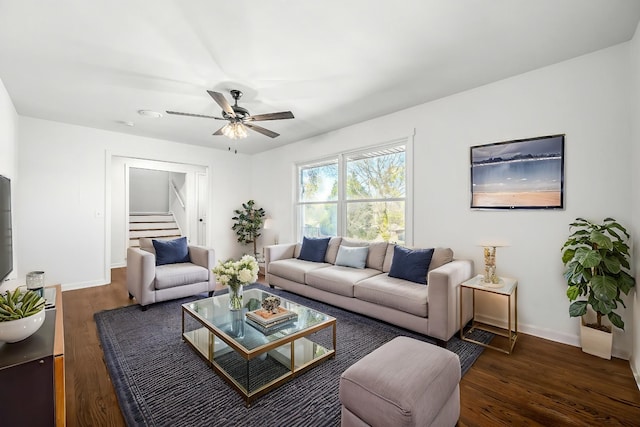 living room featuring dark hardwood / wood-style floors and ceiling fan