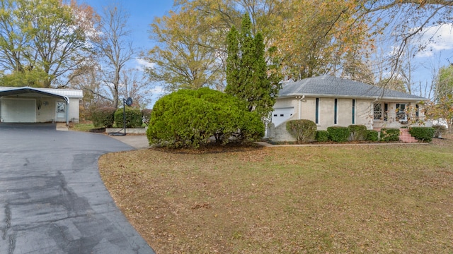 view of property exterior featuring a yard and a carport