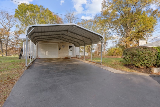 view of vehicle parking with a carport