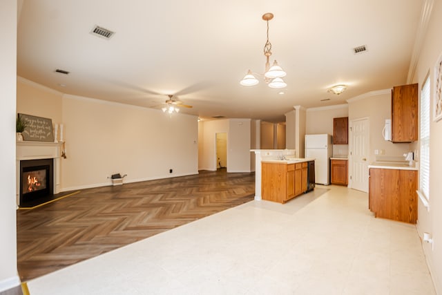 kitchen featuring ornamental molding, white appliances, hanging light fixtures, and light parquet flooring