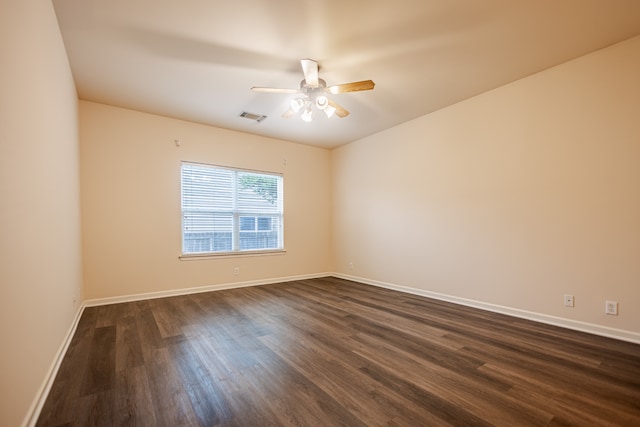 unfurnished room featuring ceiling fan and dark hardwood / wood-style flooring