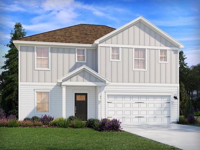 view of front facade with a front yard and a garage