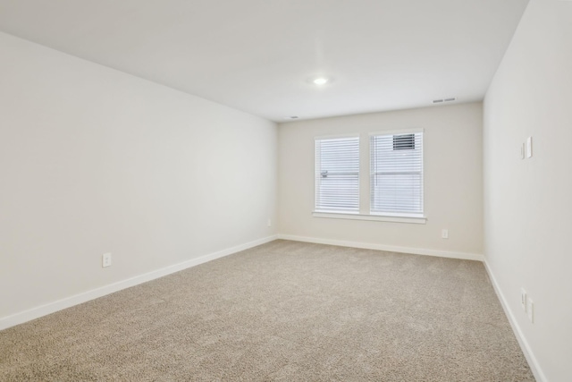 unfurnished room featuring carpet