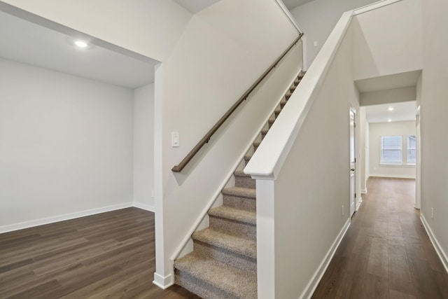 stairway featuring hardwood / wood-style flooring