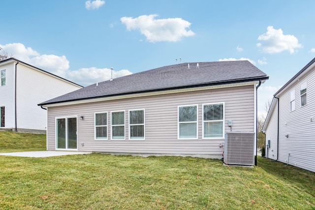 back of property featuring central AC, a patio, and a yard