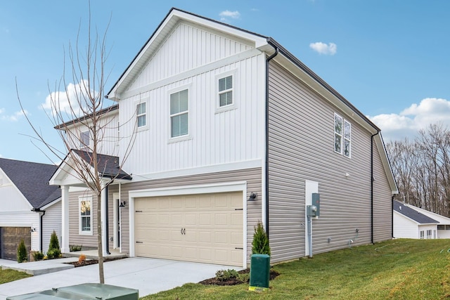 view of front of property with a front lawn and a garage