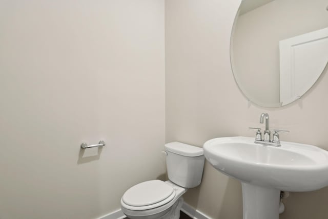 bathroom featuring sink and toilet