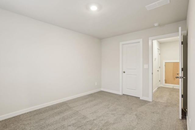 unfurnished bedroom featuring light colored carpet