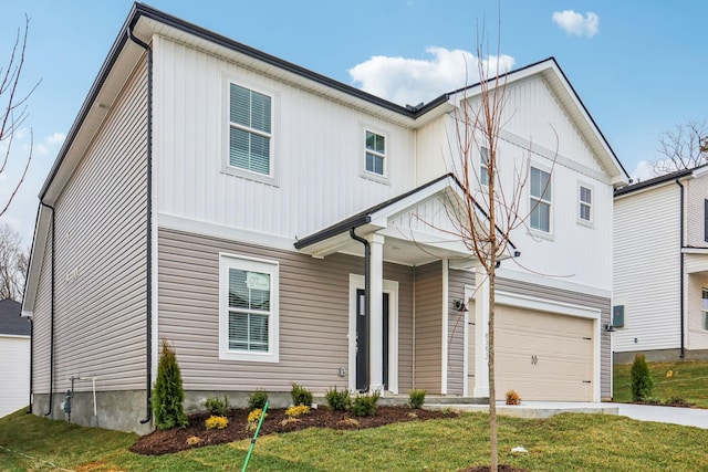 view of front of house featuring a front lawn and a garage