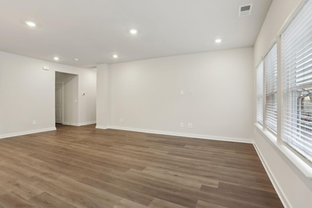 empty room featuring dark wood-type flooring