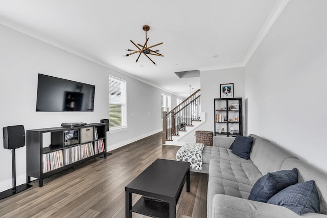 living room featuring crown molding, ceiling fan, and wood-type flooring