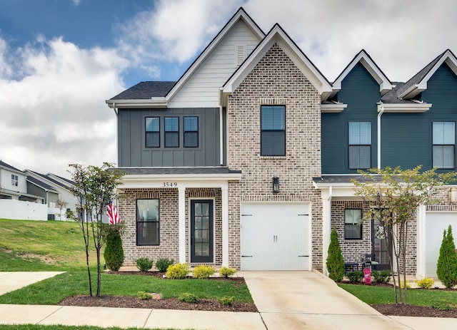 view of front of house featuring a garage and a front lawn