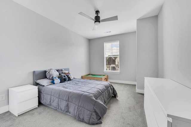 bedroom with light carpet and ceiling fan