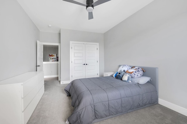 bedroom featuring ceiling fan, a closet, and carpet floors