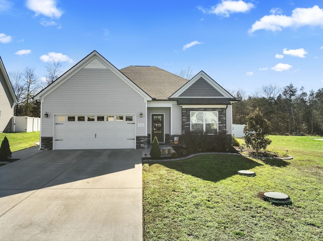 view of front facade with a front yard and a garage