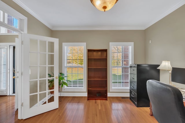 office space featuring crown molding, french doors, and hardwood / wood-style flooring